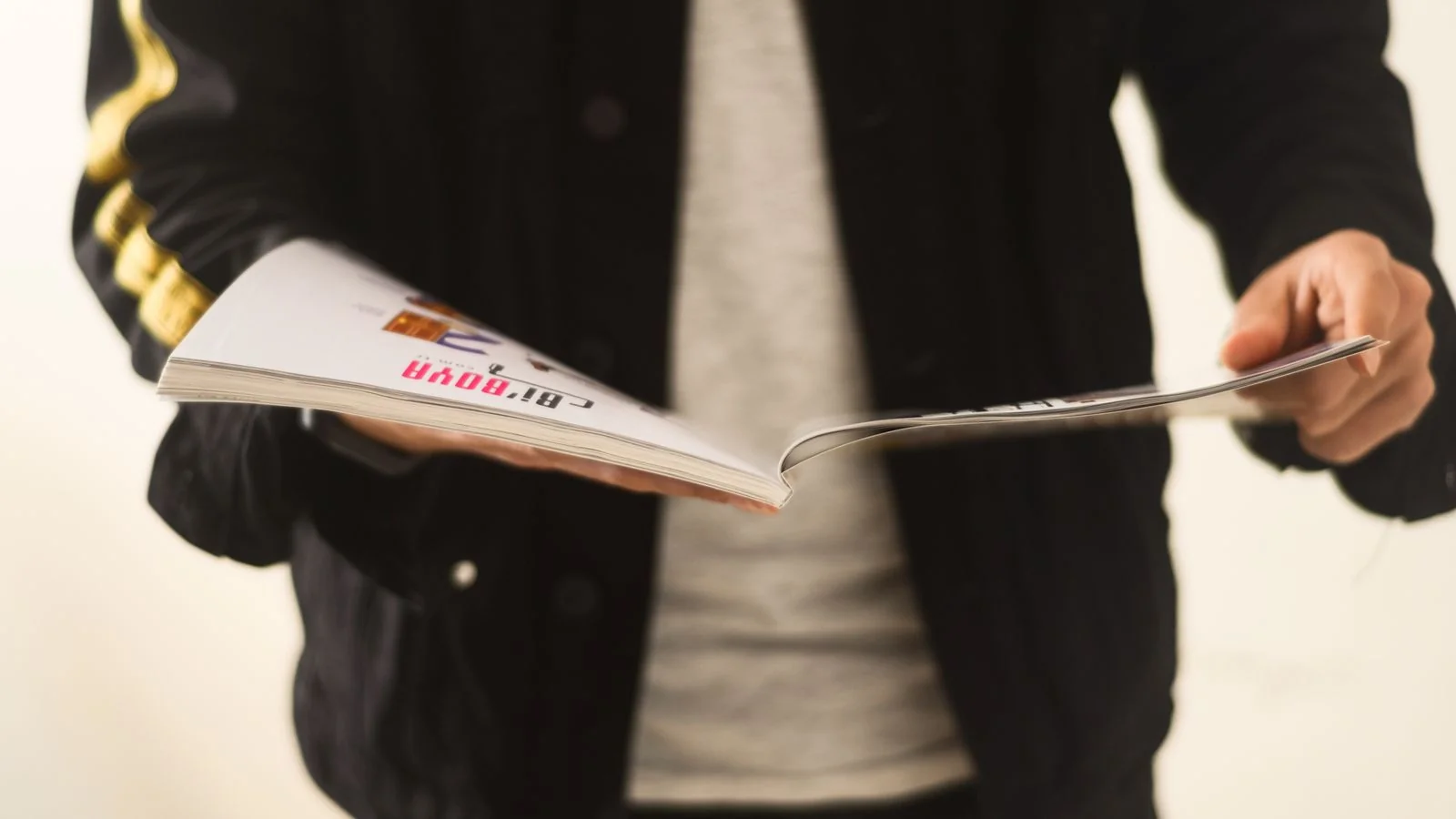 A man reading a magazine, the engaged cultural reader Rolling Stone writes for
