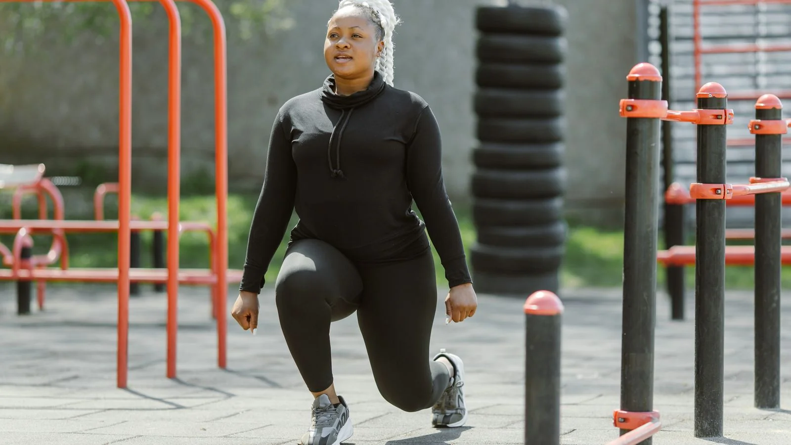A woman exercising outdoors, the practical, body-positive fitness coverage SELF is known for