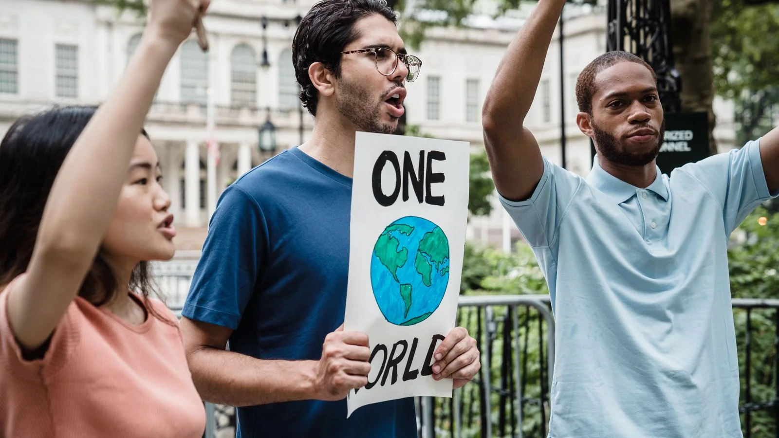 Young demonstrators holding handmade placards at a peaceful protest, the subject matter Teen Vogue built its reputation on
