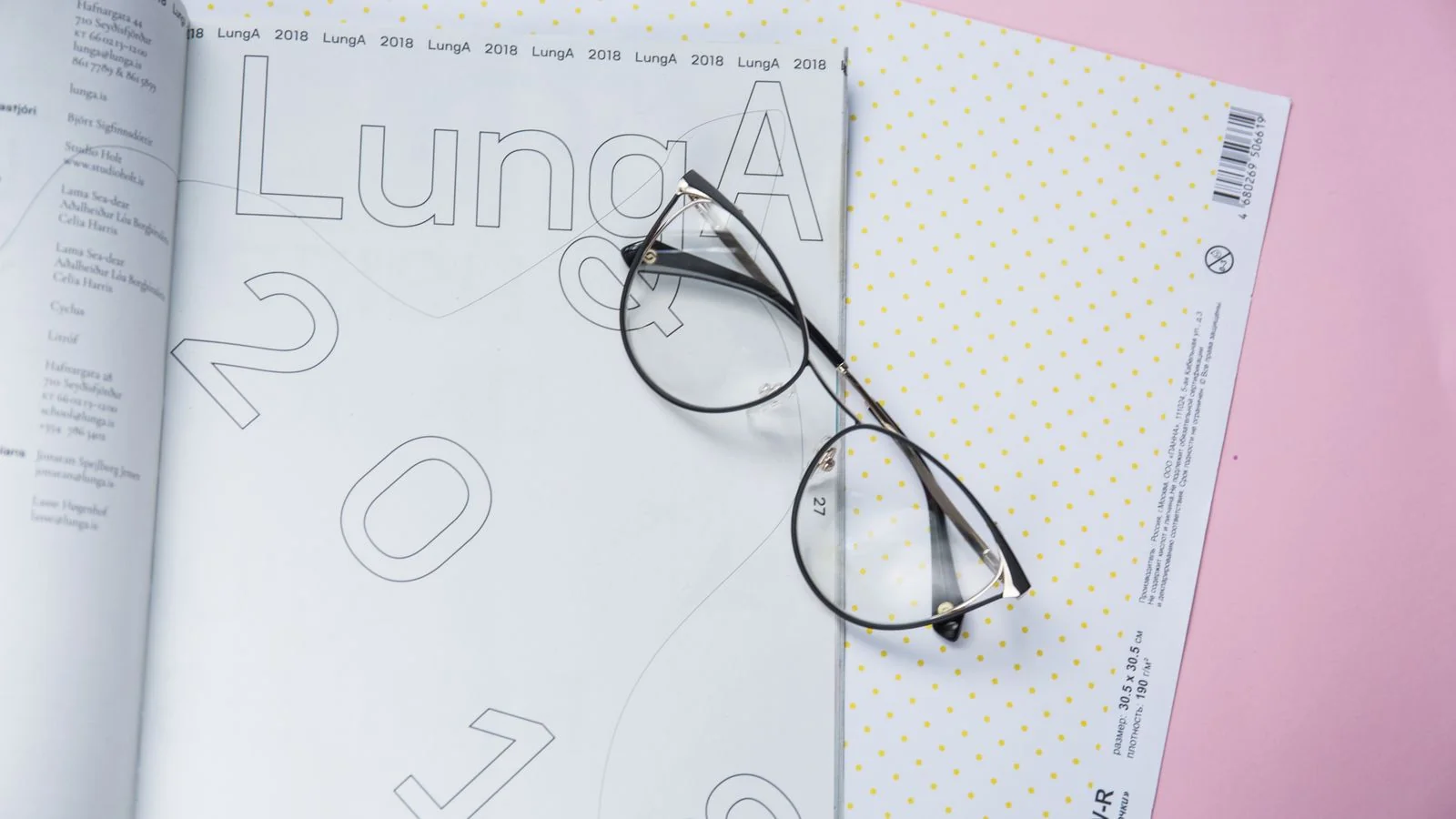Eyeglasses resting on an open magazine, a flatlay evoking the considered reading The Cut earns