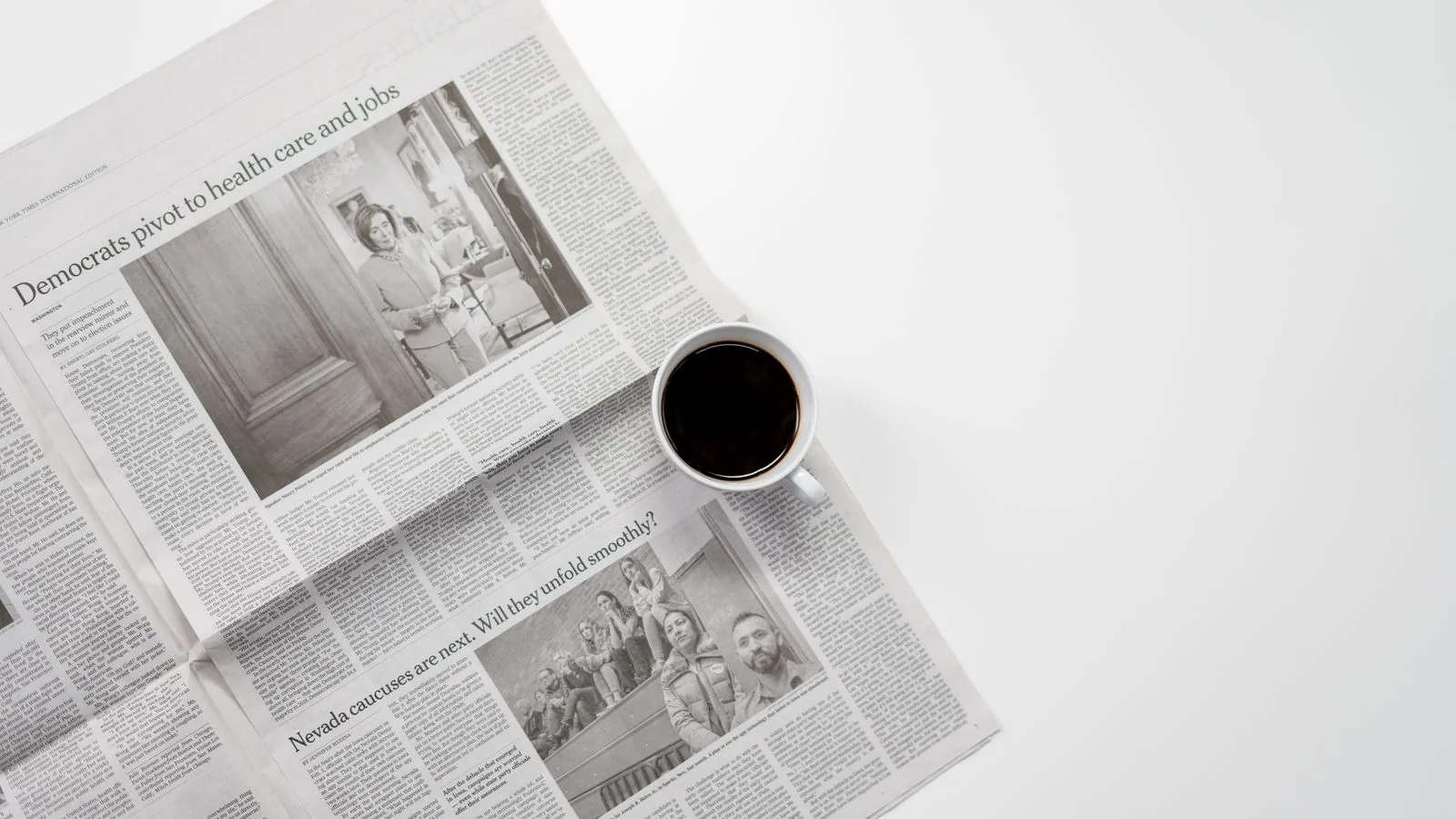 Coffee resting on a folded newspaper, the morning read Times commissioning is calibrated to