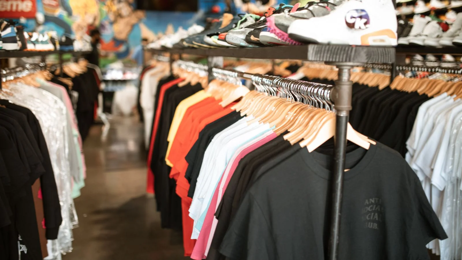 Trendy clothing and shoes on display in an urban streetwear boutique