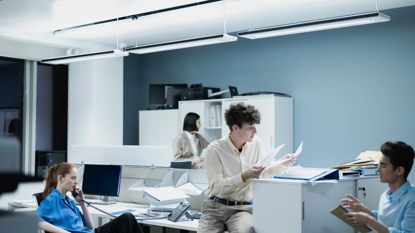 Office team working through documents together, the multi-person review every NerdWallet article passes through