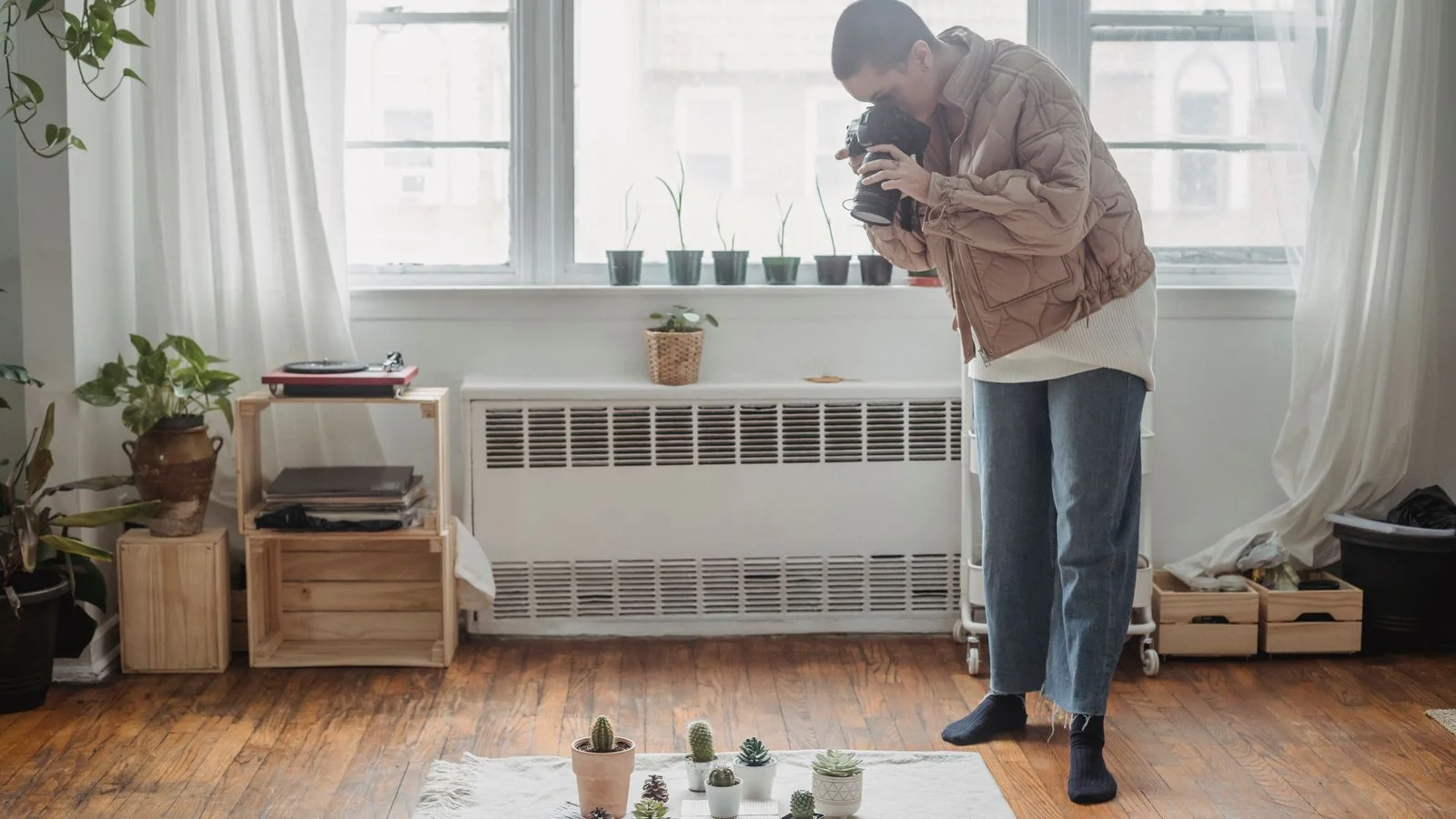 Photographer shooting a styled living room, the finished image set that goes in the submission link.