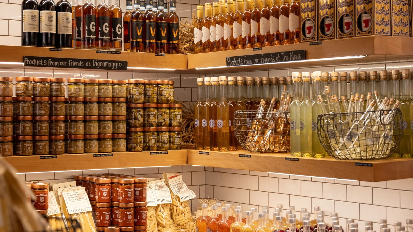 A rustic store display of Italian wines, spirits and gourmet products.