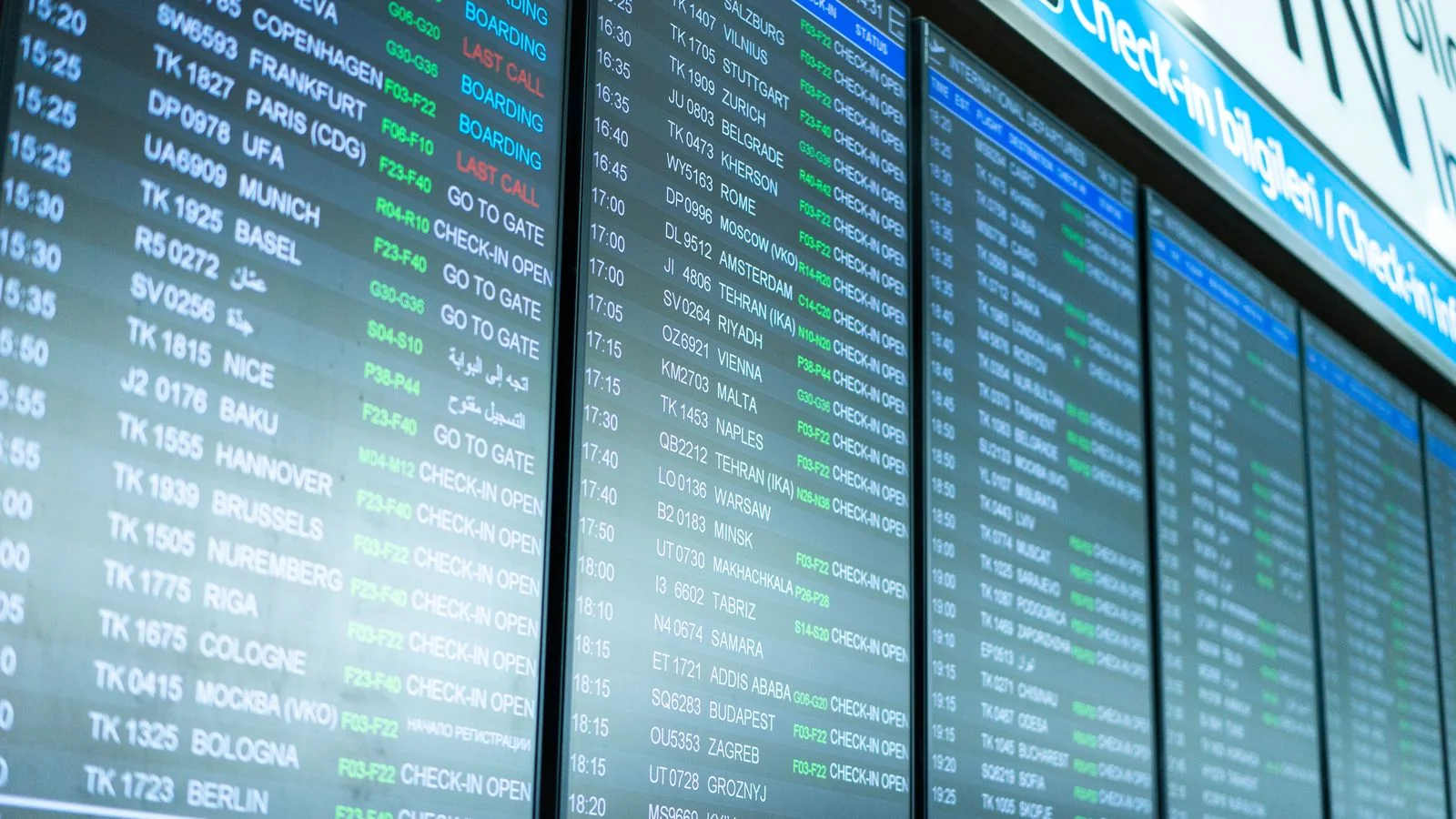 Airport departure boards showing flight information, the moment a client discovers what they booked without help.