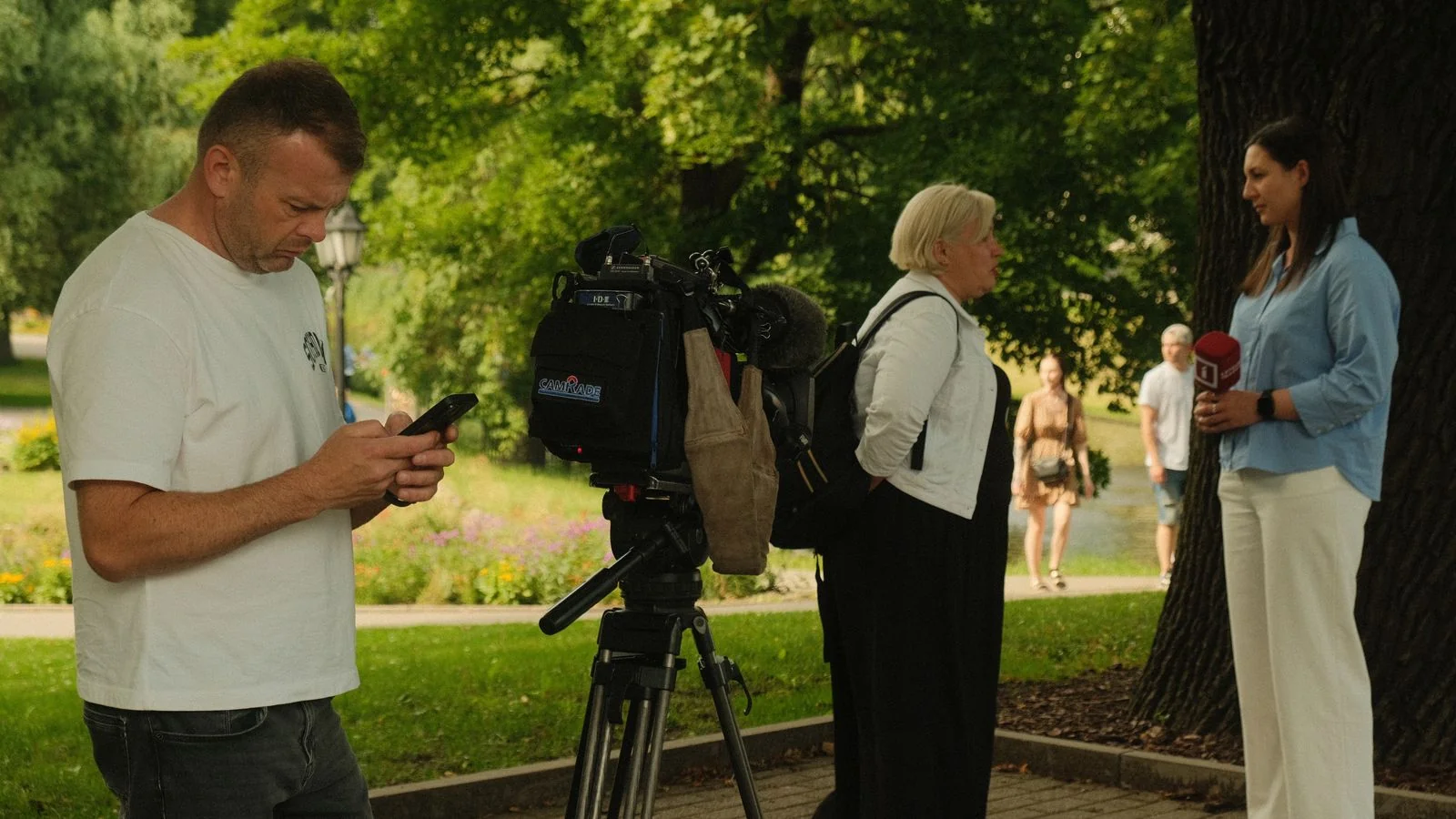 A reporter interviewing a source and taking handwritten notes during an interview