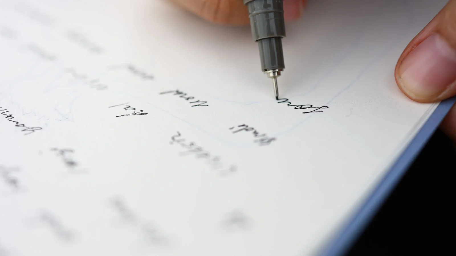 A hand writing citations on paper, the visible sourcing Perplexity puts next to every answer