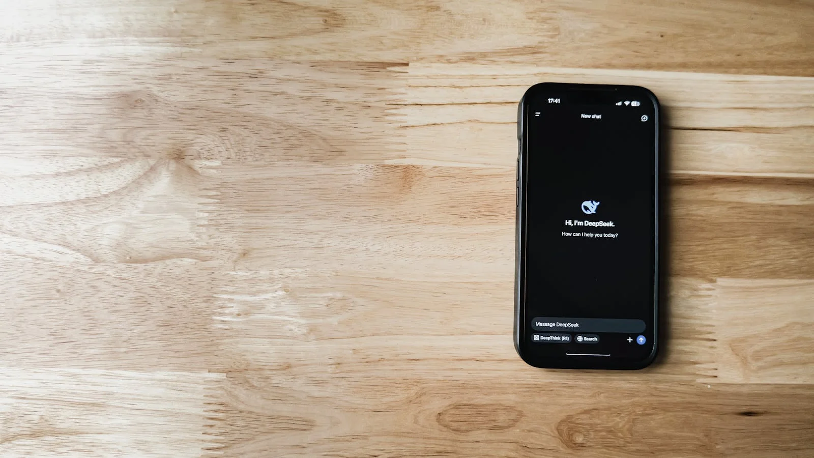 Mobile phone displaying an AI chatbot recommending products to the shopper
