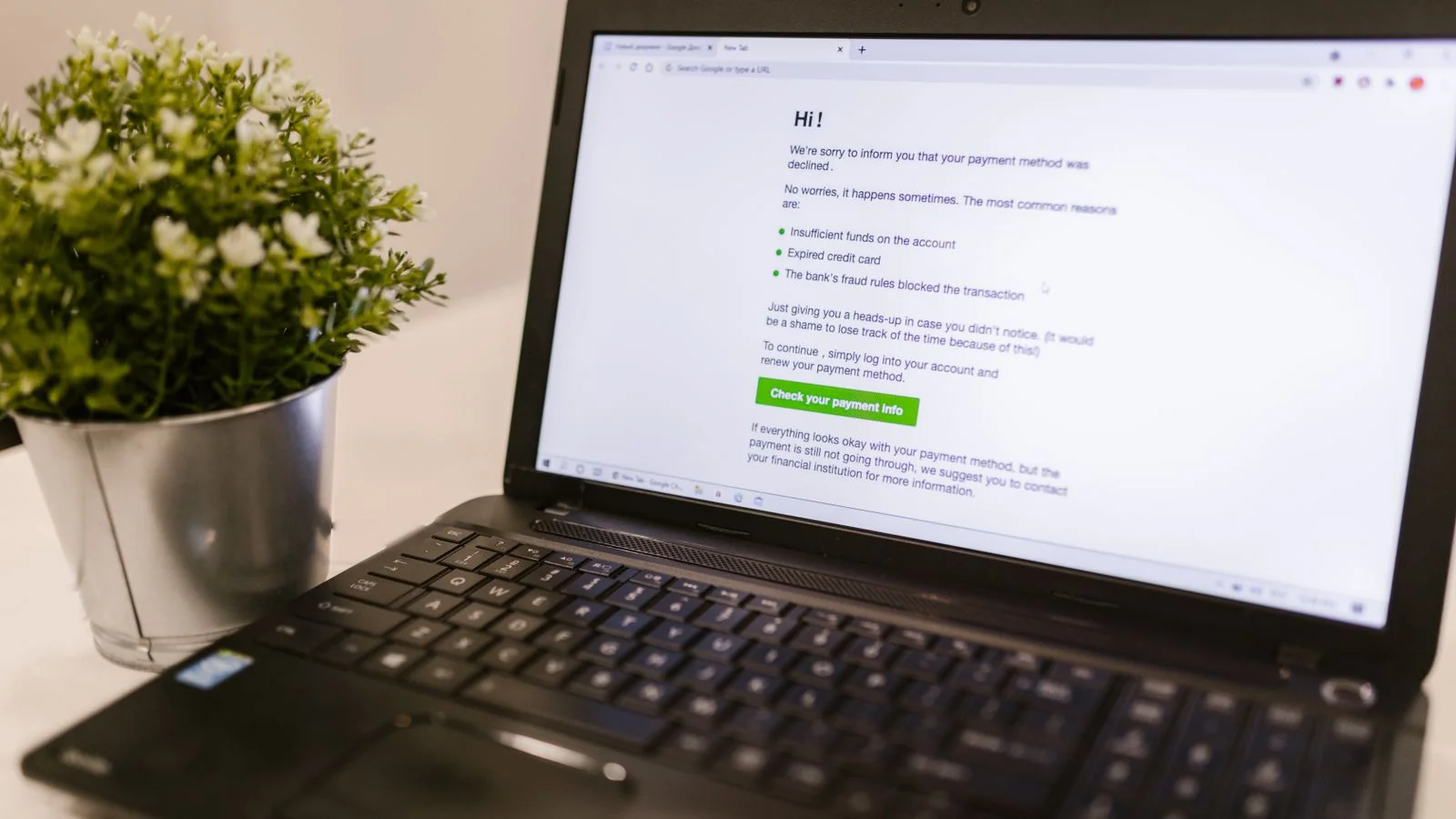 A laptop on a desk showing a notification, the search and alert surface owners should sweep weekly