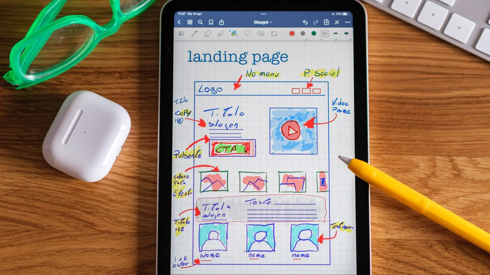 Two people reviewing a website wireframe and layout, the structural work that makes a page legible to a machine