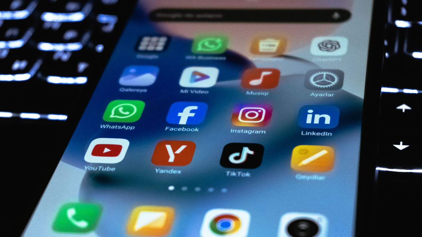 Smartphone home screen of social apps, each one a profile that can rank for your name