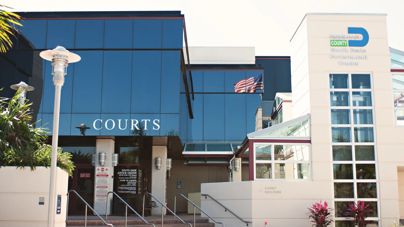 A modern justice center and government building facade