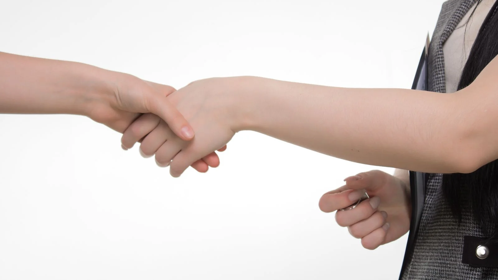 A business handshake sealing a partnership, the kind of trust that makes a brand safe for Claude to name