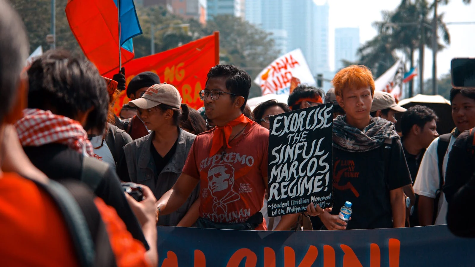 A diverse crowd marching with handmade signs through a city street, illustrating the shift from a small believer group into a public force.