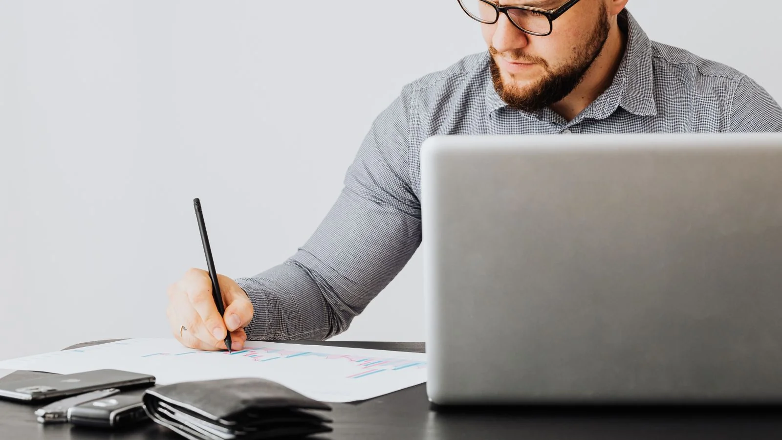 HVAC technician writing up a service report