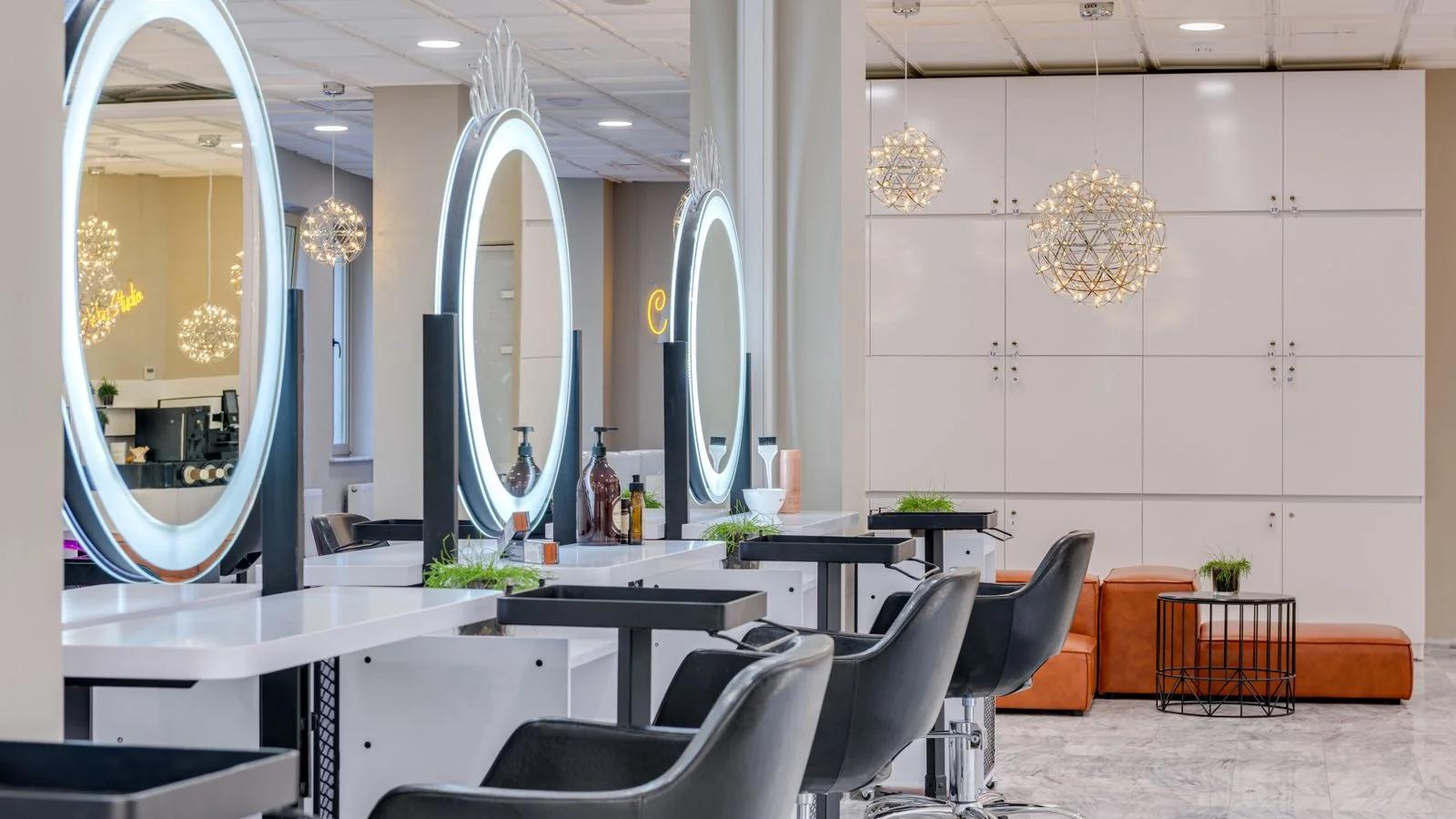 A bright salon interior with round mirrors and clean modern lighting, the standard a disclosure release puts into words