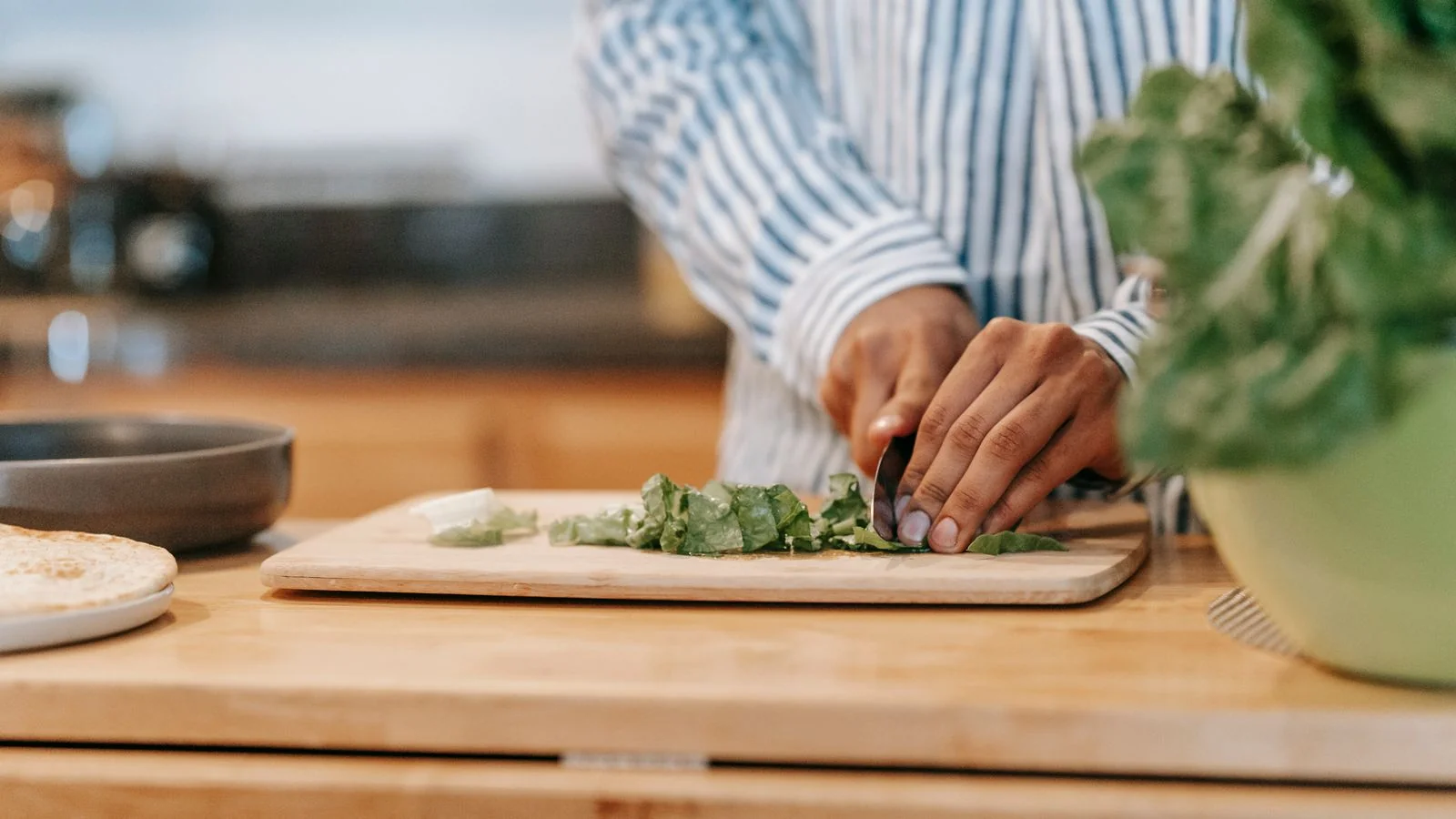 Fresh vegetables being prepared on a cutting board at home