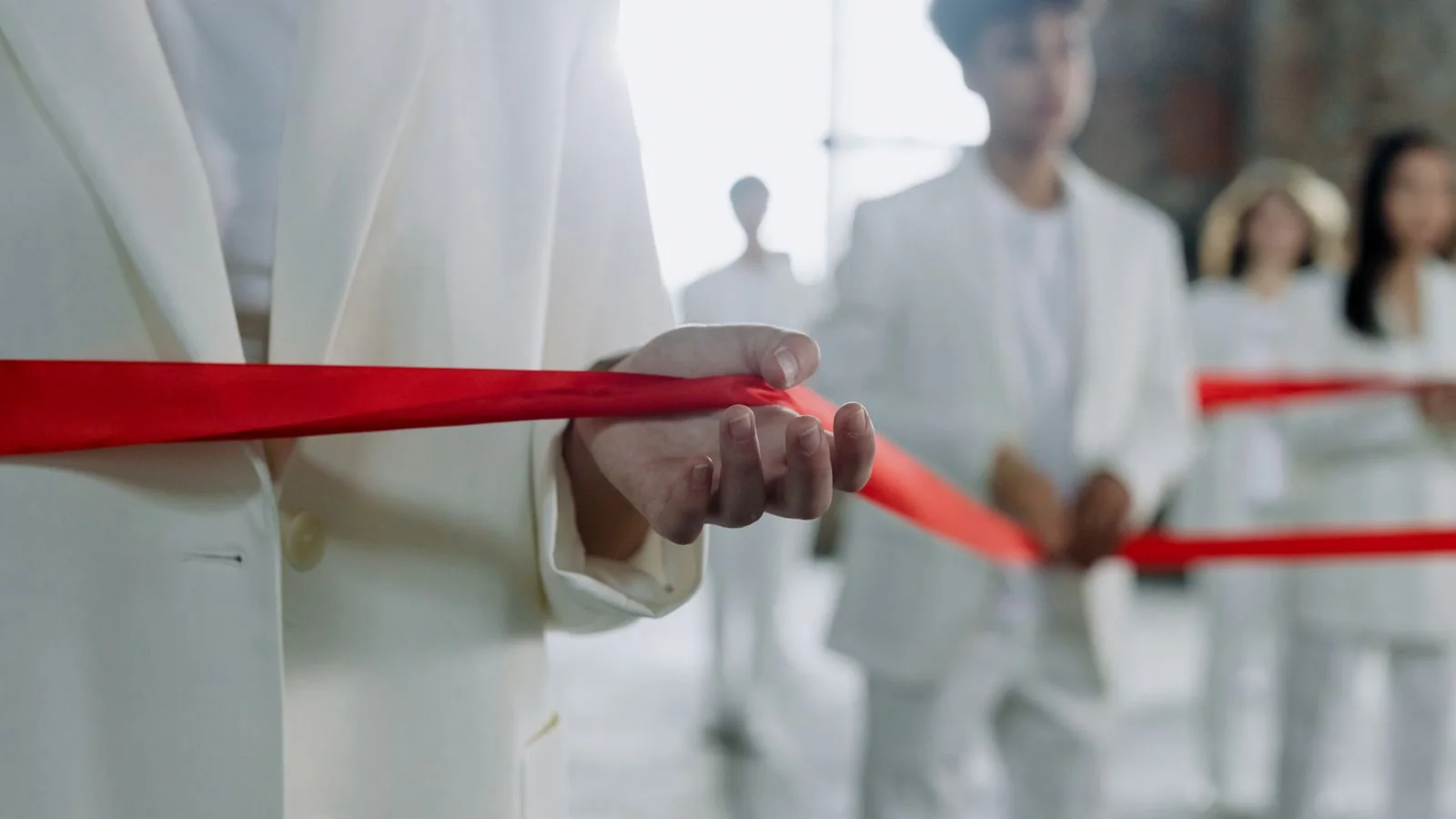 A group holding a ribbon at an opening ceremony, the photograph that is not a story on its own