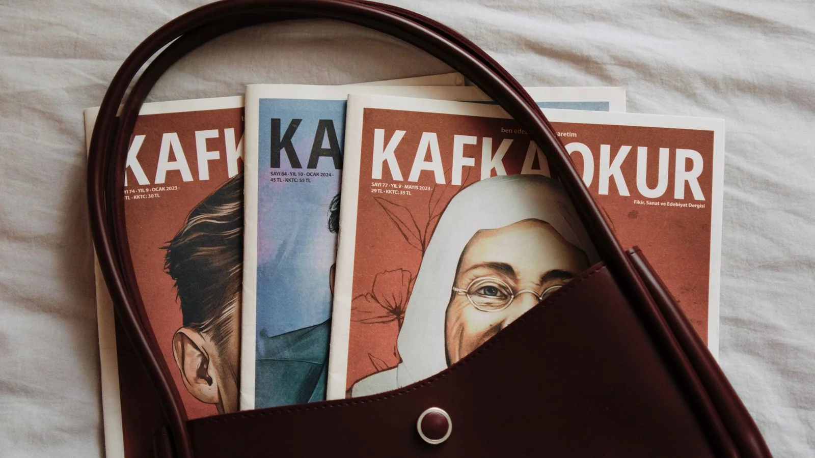 Magazines displayed in a leather bag, the quarterly print product that still anchors Chief Executive's authority