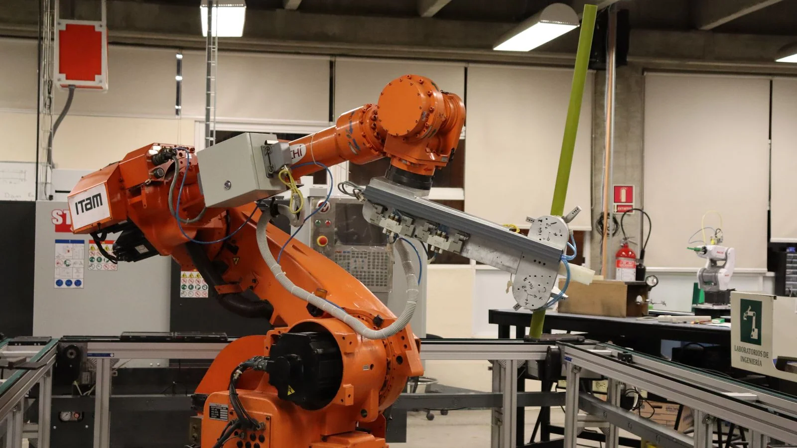 An industrial robotic arm in a laboratory, the kind of subject this magazine treats seriously