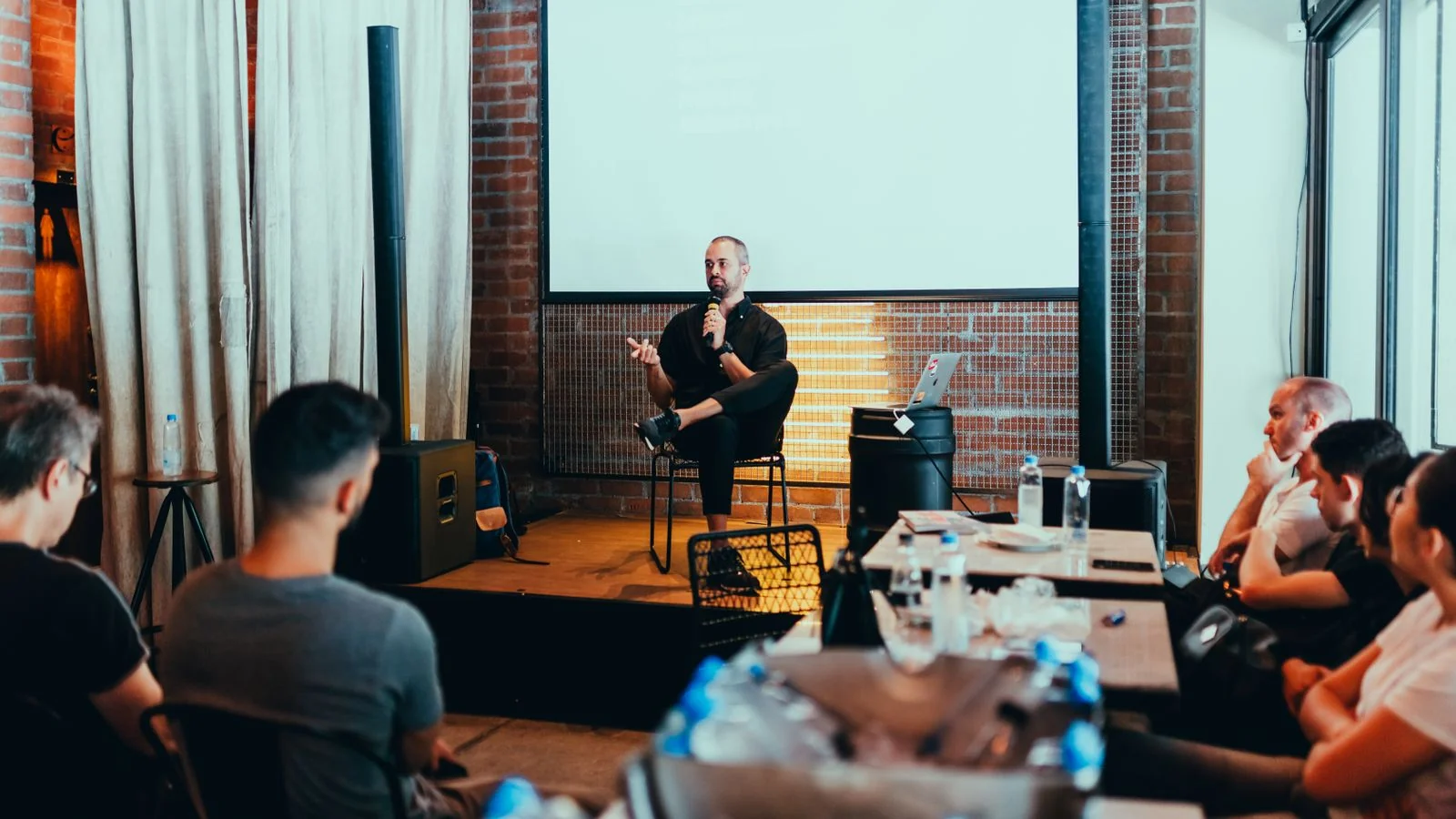 Speaker addressing a conference audience, one of the routes into MarTech's invite list