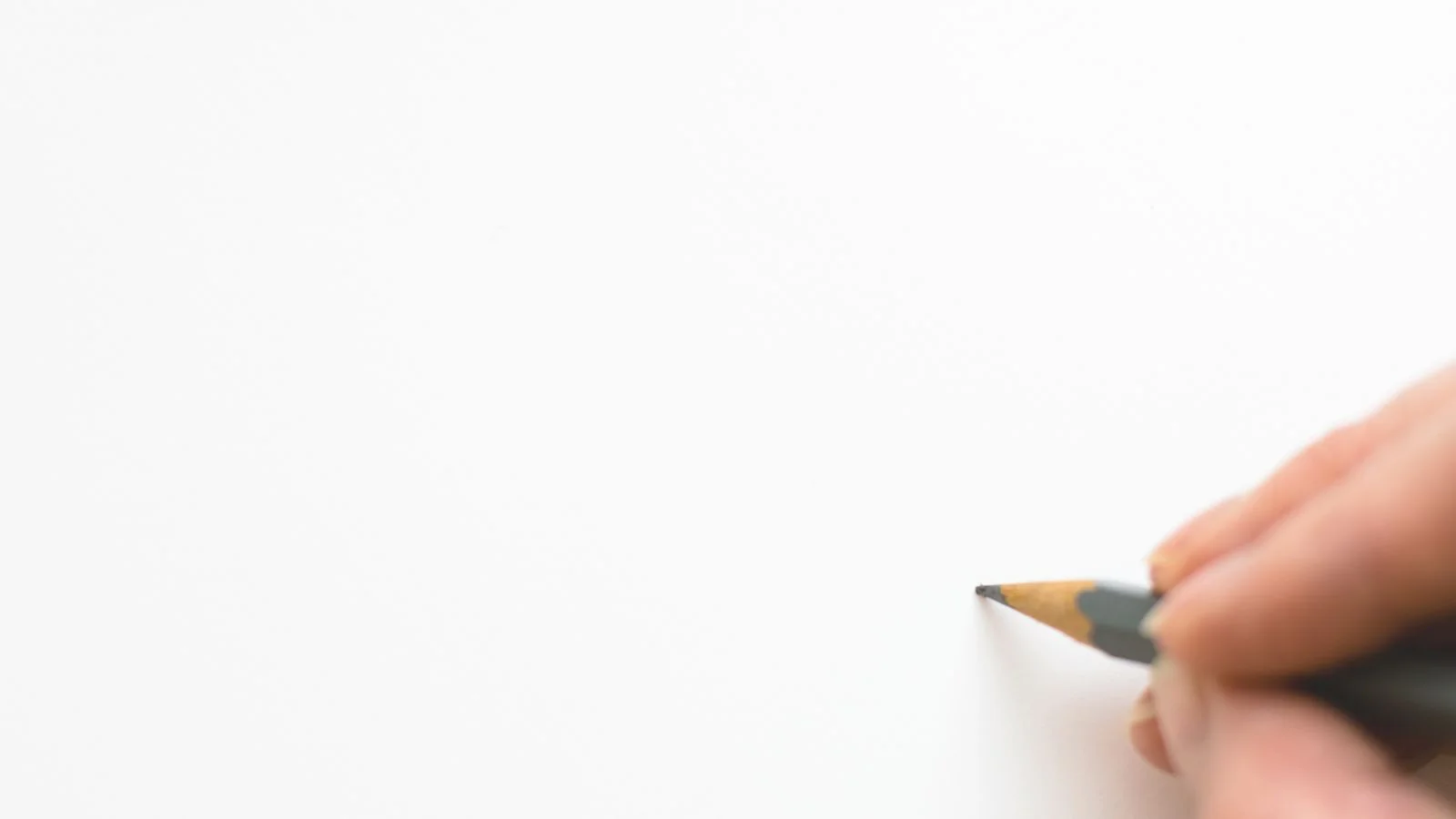 Hand sketching on white paper with a pencil, mapping the steps toward a Moz invitation