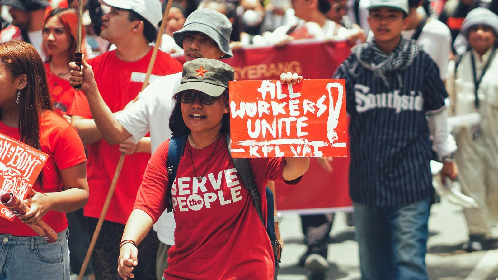 Workers marching in a rights demonstration, the kind of story that starts on the ground