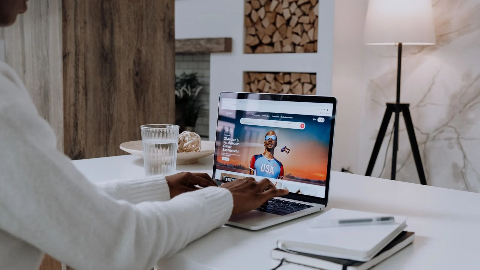Person using a laptop with online content open, reviewing what search shows for a brand