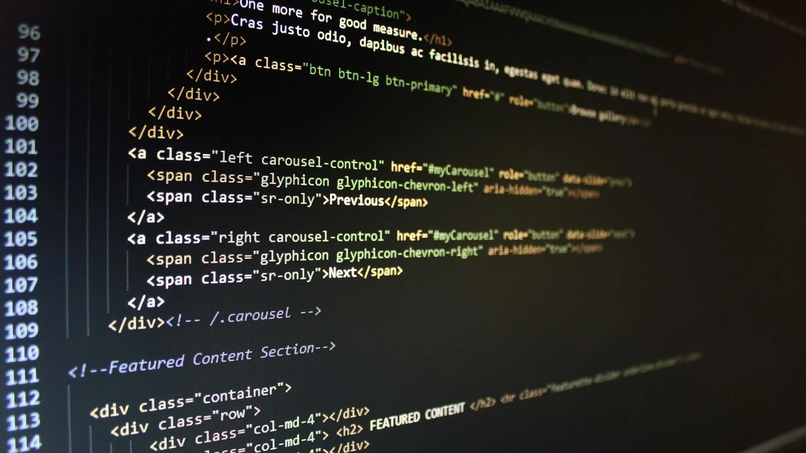 HTML code displayed on a monitor, close to the clean markdown structure llms.txt is meant to provide