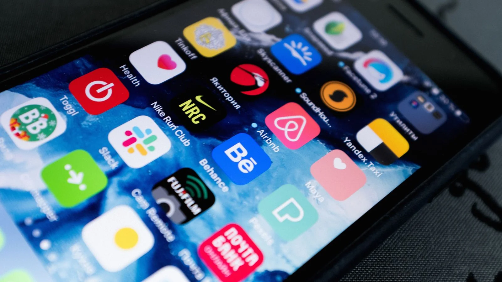 A phone screen full of app icons, the fast feed where short-form content has to win attention in passing