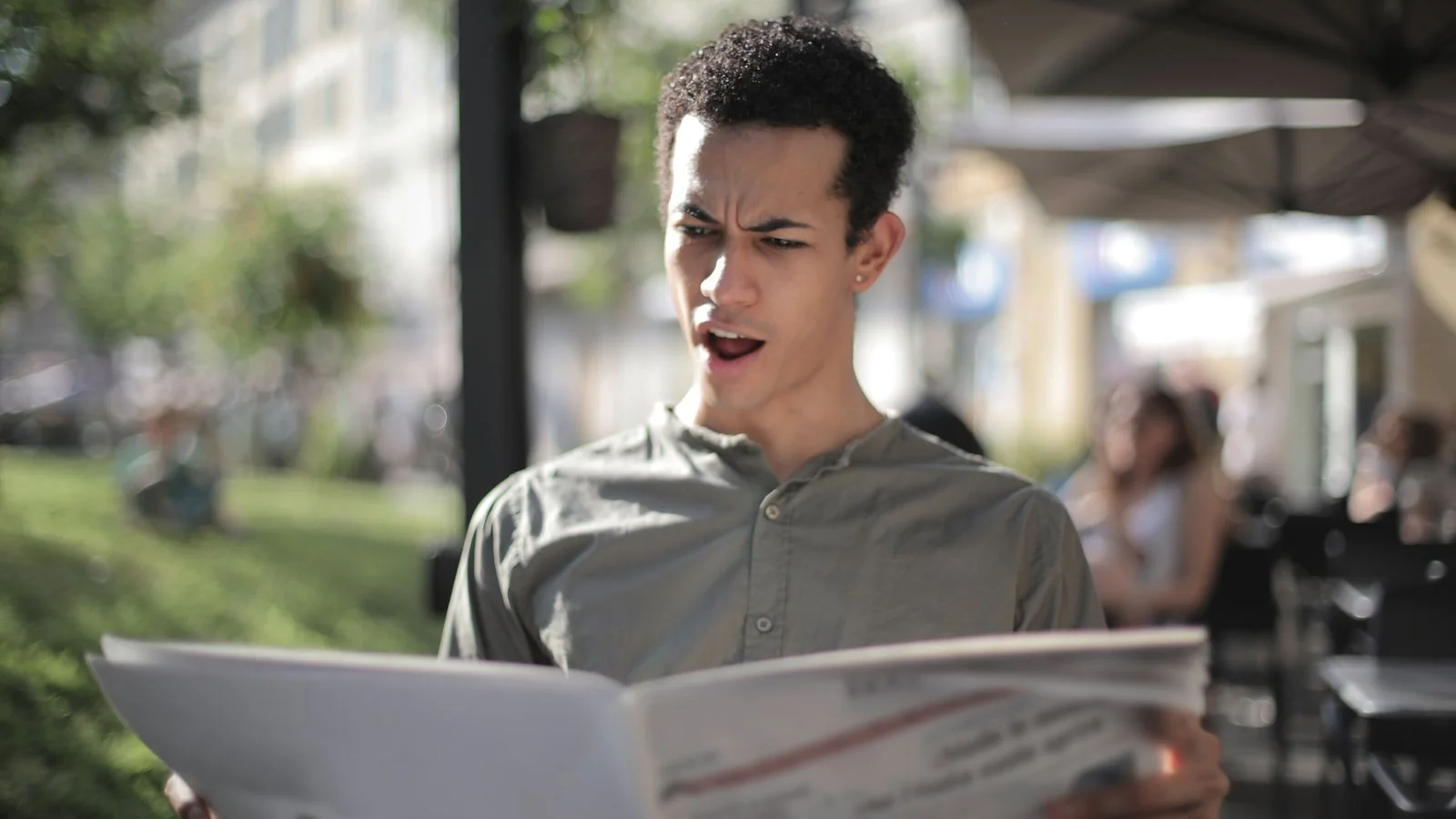 A reporter holding a microphone during a live broadcast, the fast coverage window newsjacking targets