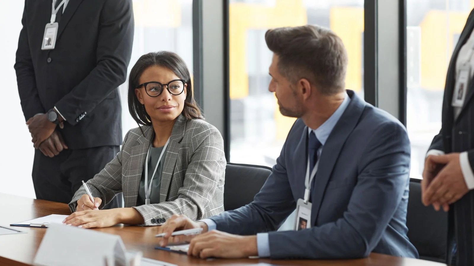 Diverse professionals in a boardroom discussion, the kind of decision quietly shaped by an online search beforehand