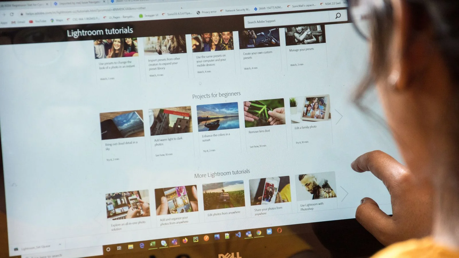 Woman studying images on a laptop screen, the way a subscriber reviews before and after screenshots of removed listings