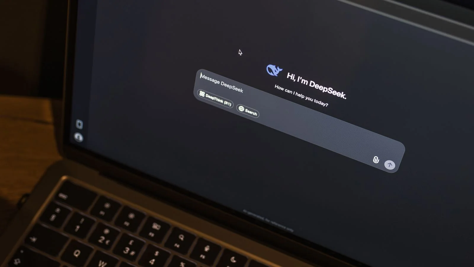 A laptop showing an AI assistant interface at night, the moment a query becomes a synthesized answer