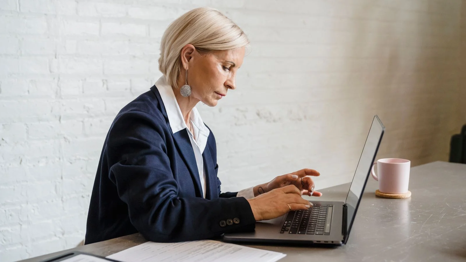 Professional working on laptop building a strong digital presence and LinkedIn profile