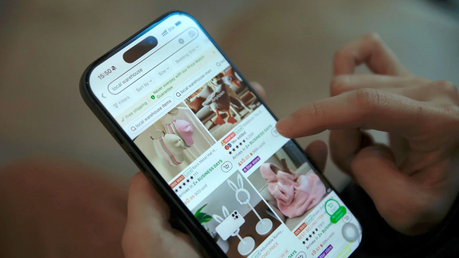 A shopper browsing a shopping app on a phone, the comparison moment AI search now mediates