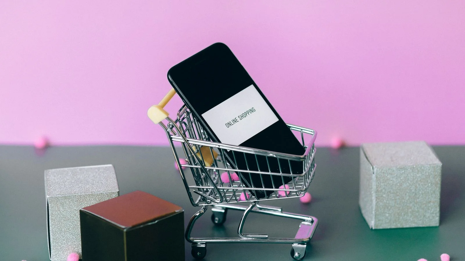 A phone resting on a small shopping cart, a reminder that real reviews shape what AI repeats
