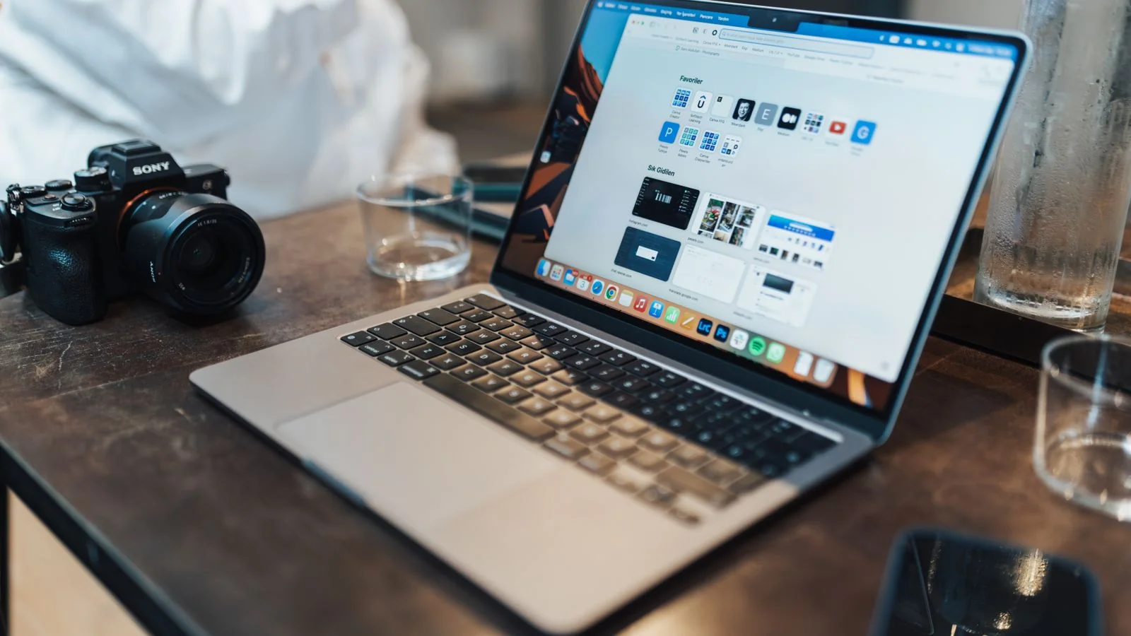 Laptop and camera on a clean desk, the kind of setup used to audit search results