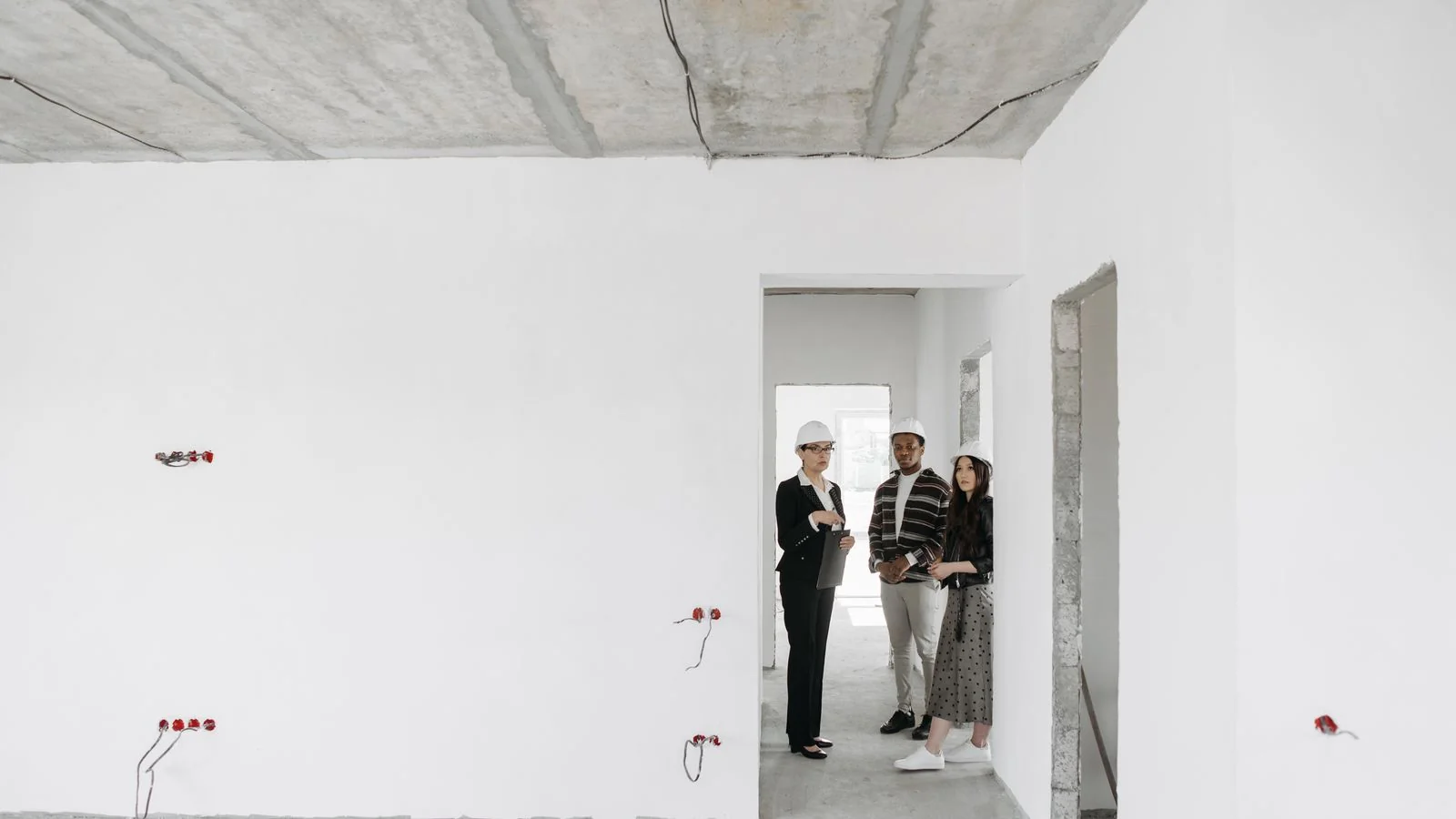 A contractor walking a client through the plan on site, where trust is built face to face.