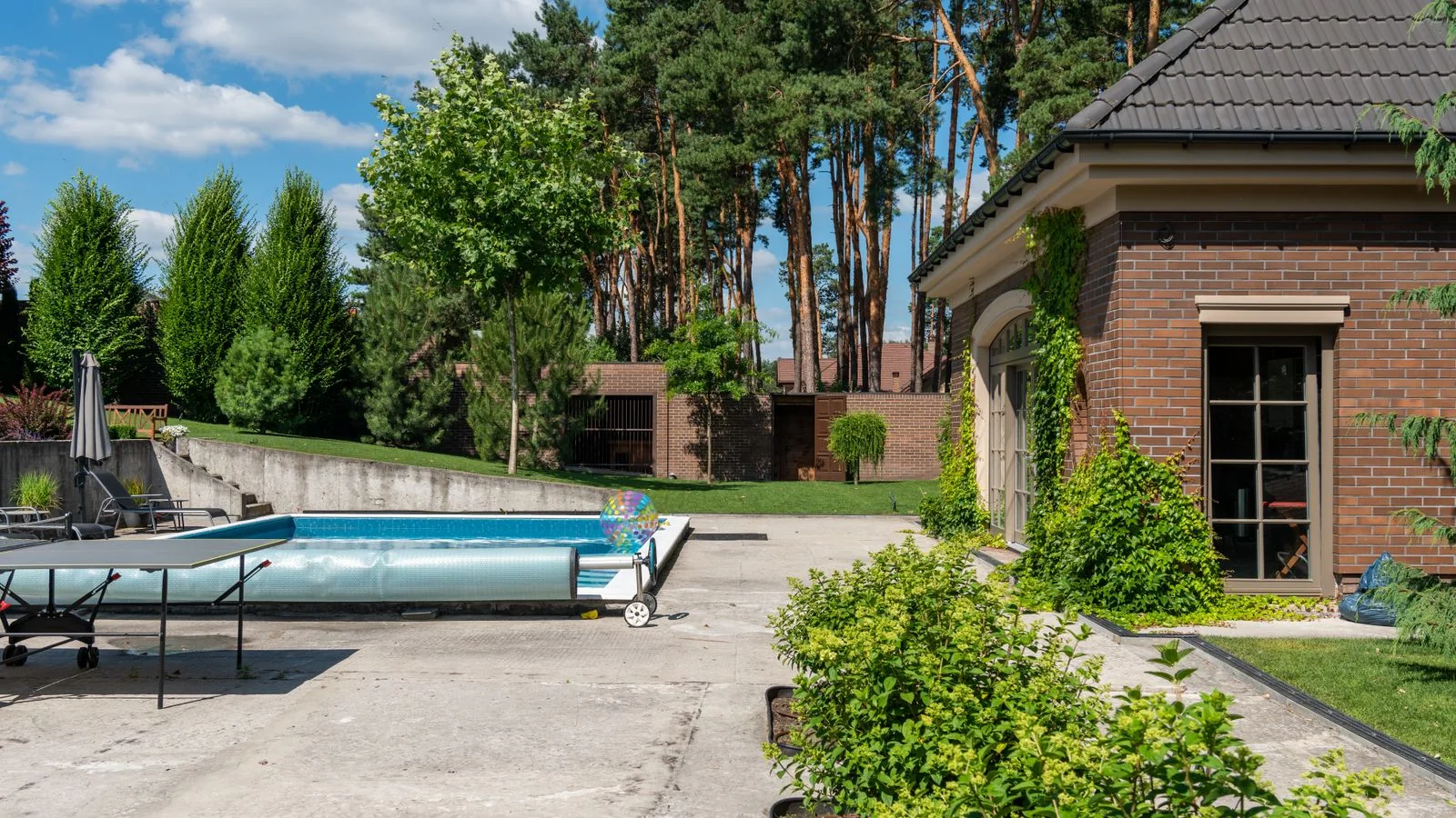 A finished backyard with pool decking, the kind of portfolio proof that sells the next concrete job.