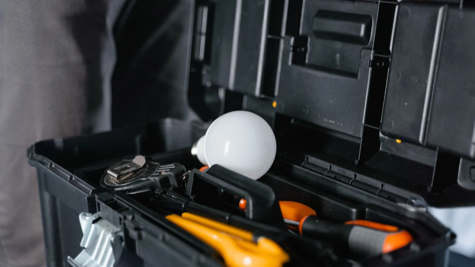 Electrician portrait with tools, the recognizable face of a local brand