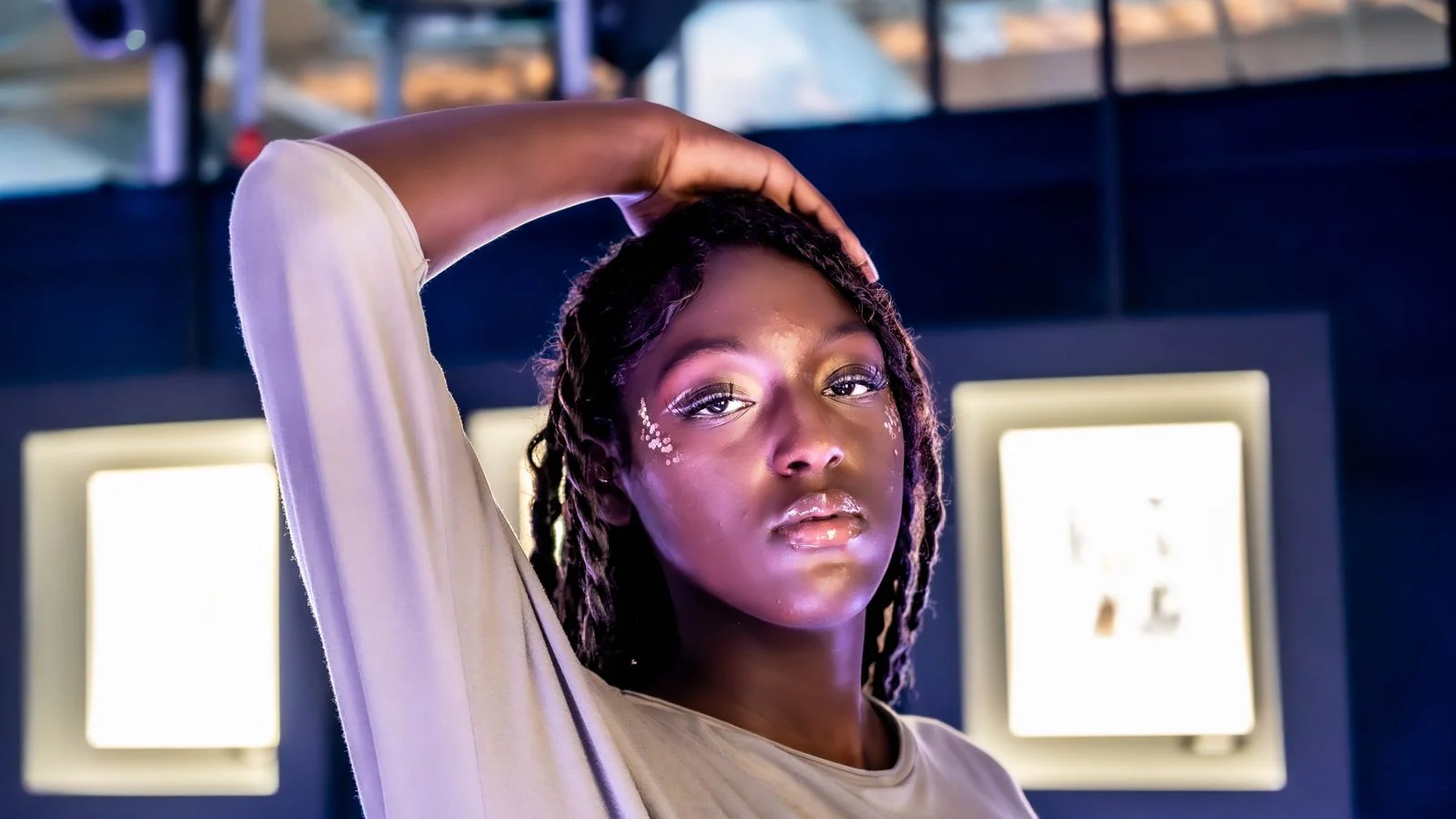 A portrait of a woman with strong creative makeup in a studio, the signature look that makes an artist's work recognizable at thumbnail size