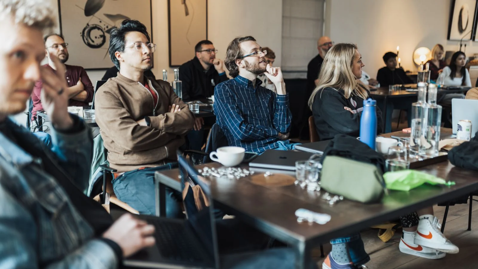 Adults in a conference room watching a presentation, the audience a creator is competing for