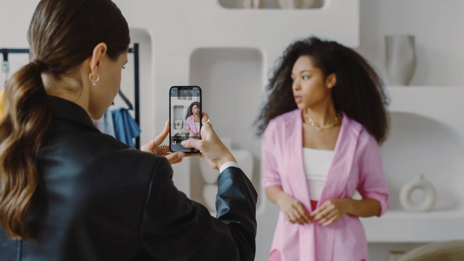 A person photographing with a phone.