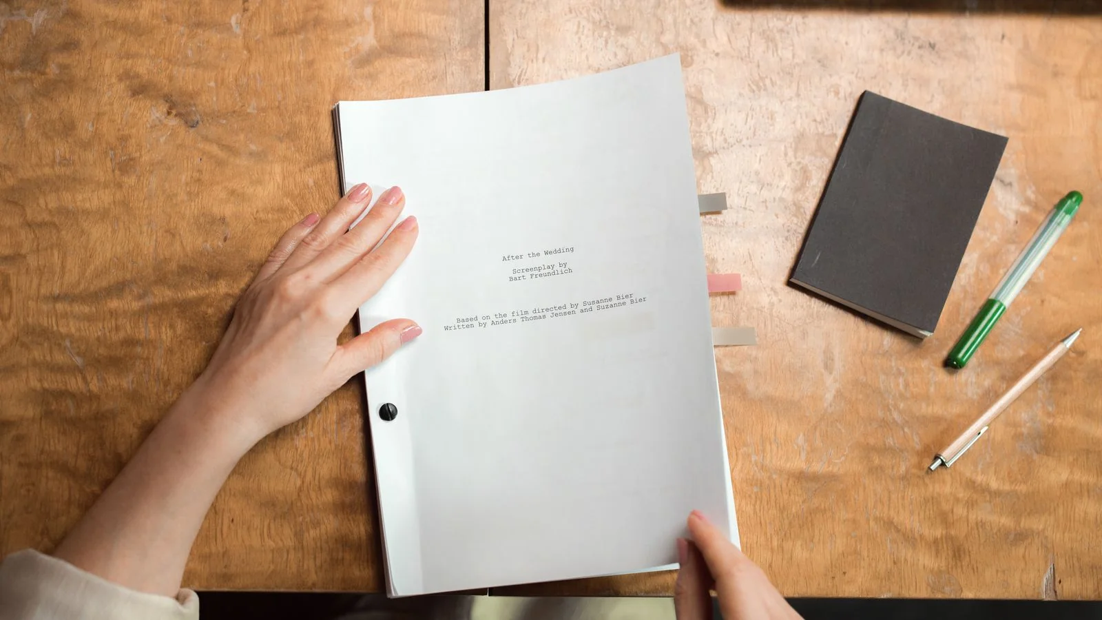 Documents laid out on a desk, the announcement most shows send and nobody runs