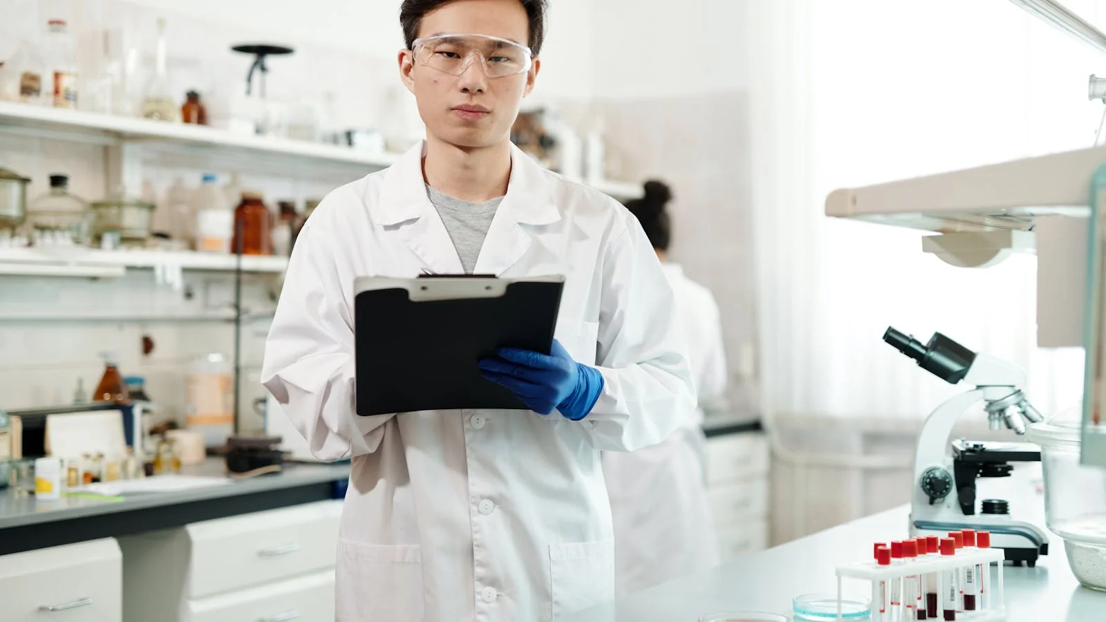 A scientist analyzing data in a modern lab, the source material a release must represent without overstating