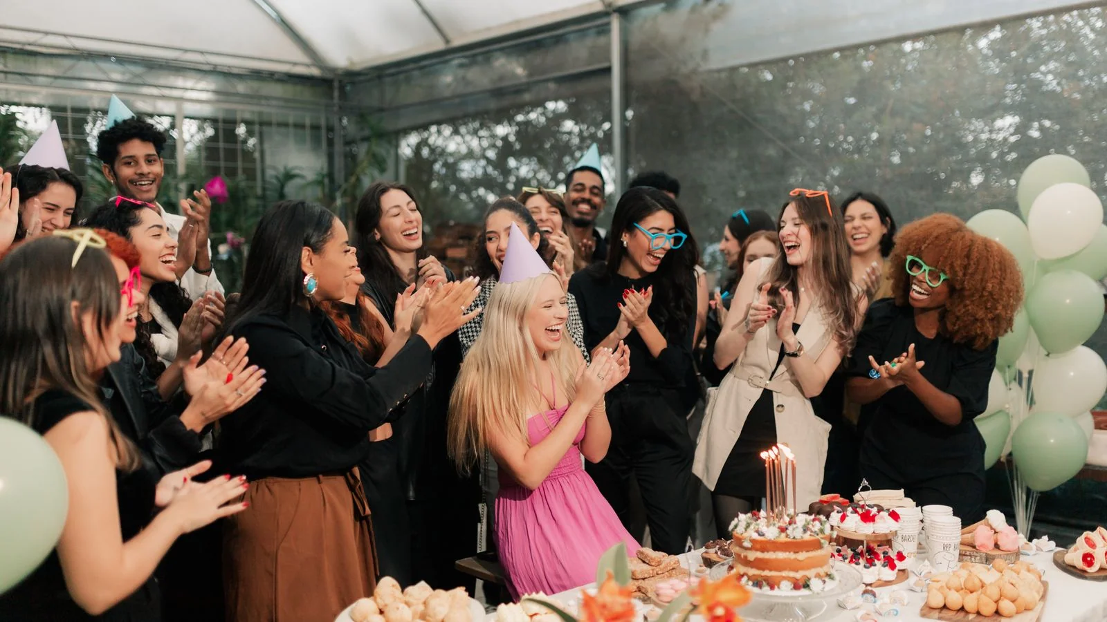 People gathered in celebration around a funding milestone, the moment a campaign tips past its target