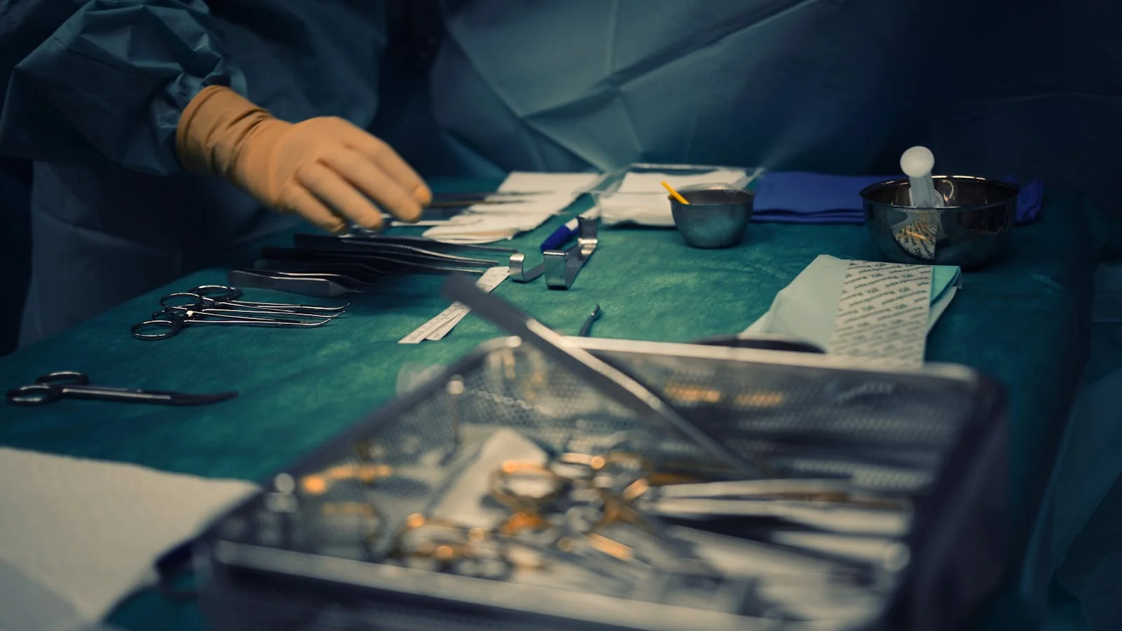Close-up of surgical instruments laid out for surgery on a sterile table in a hospital operating room, illustrating the clinical context of a device launch.
