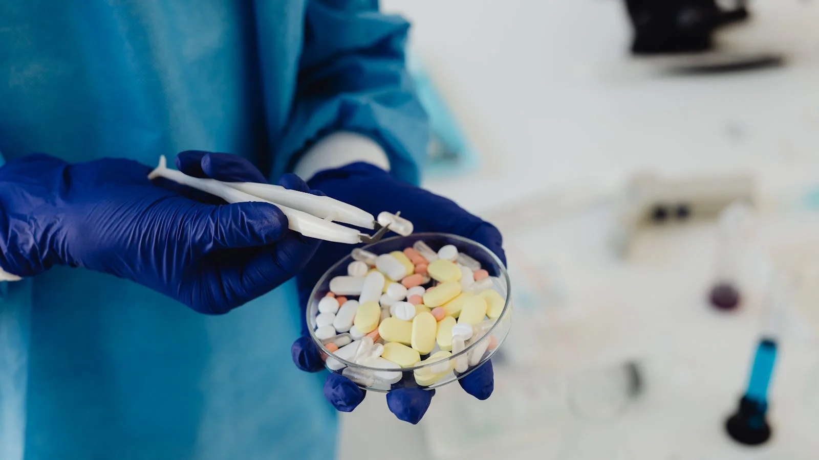 A scientist handling pills in a petri dish, the controlled detail behind every pharma claim